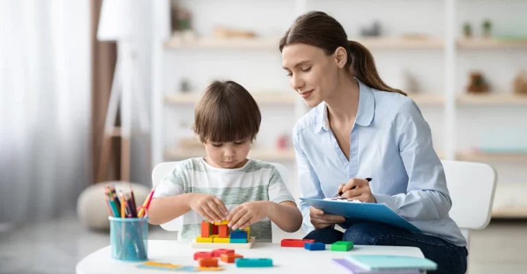 teacher helping child student