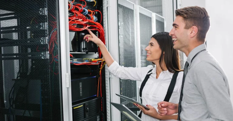 a man and woman looking at a computer career focused education