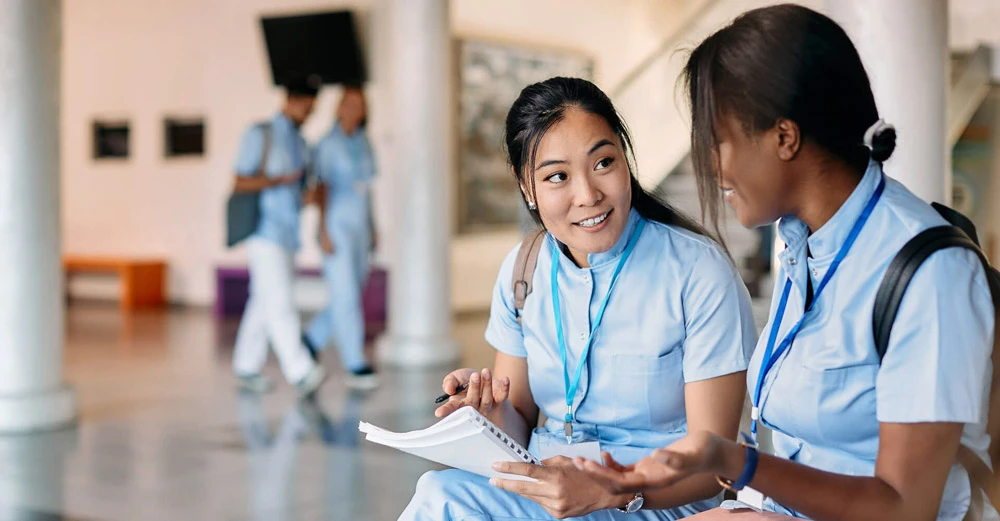a group of women sitting and talking medical office assistant