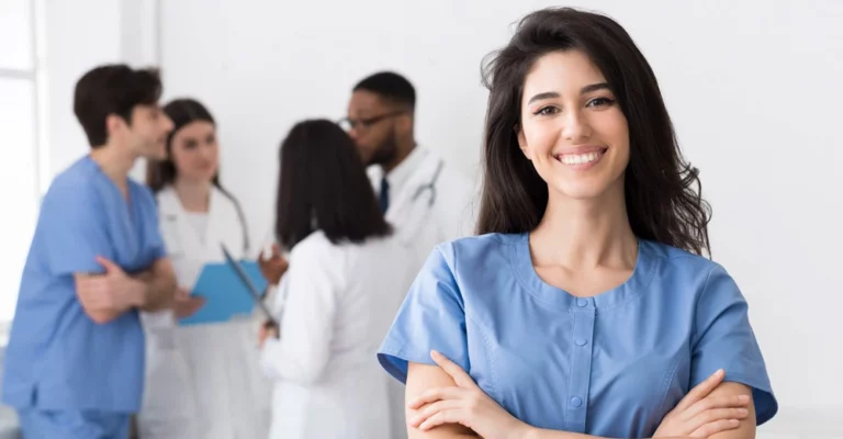 a woman smiling with her arms crossed medical office assistant