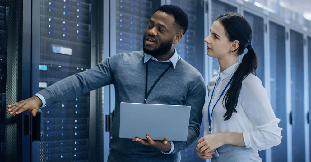 network administrator showing woman servers