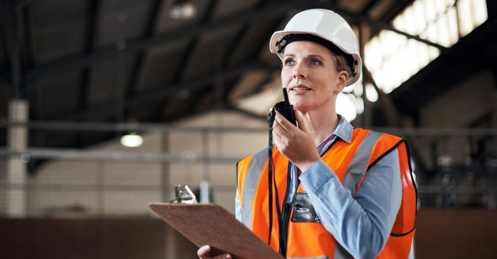 Supply chain manager professional working in a company warehouse.