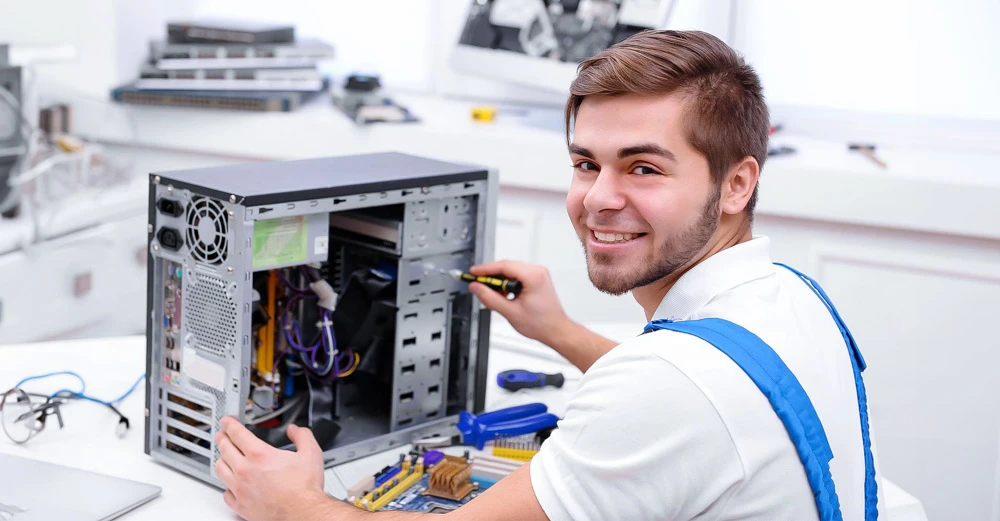 A computer technician working on a PC.