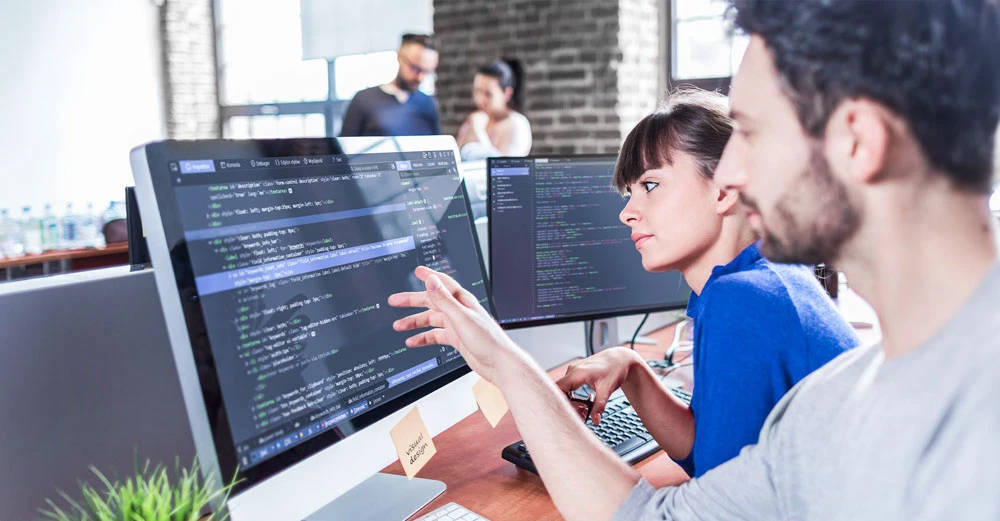 Two developers reviewing code.