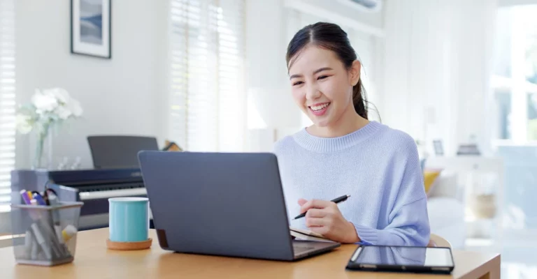 young woman working on laptop