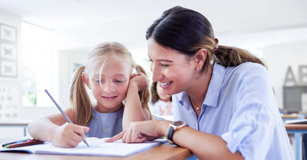 woman helping child with homework