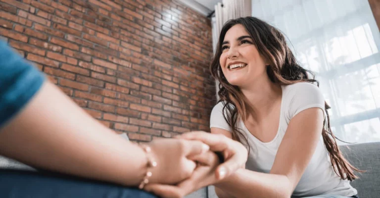 a woman holding a person's hand