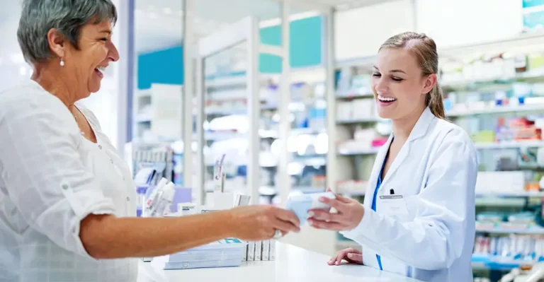 Friendly pharmacy assistant helping customer with medication.