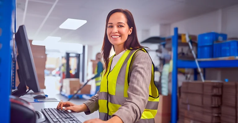 woman in PPE working in supply warehouse