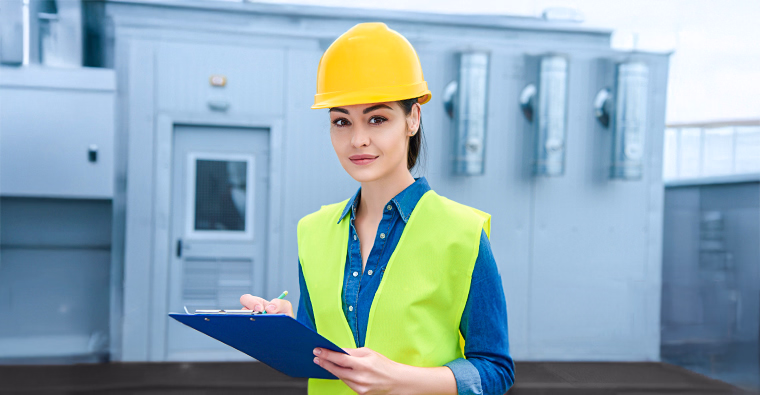 Woman in hard hat and safety vest holding clipboard, highlighting an oil and gas career path.
