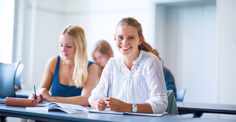 Career college students in class, highlighting Sundance College’s one-class-at-a-time and practicum-based diploma programs.