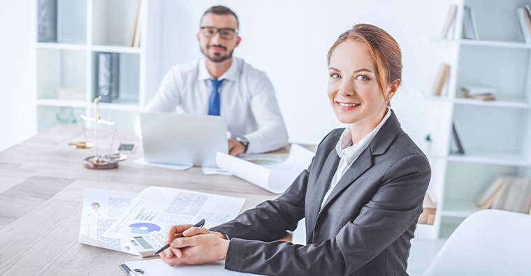 A woman and a man work at a table, representing fast-growing careers.
