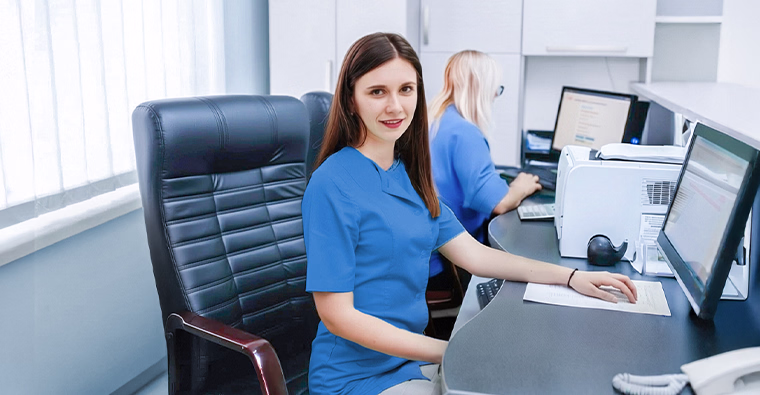 A woman works in a medical environment after starting a new career.