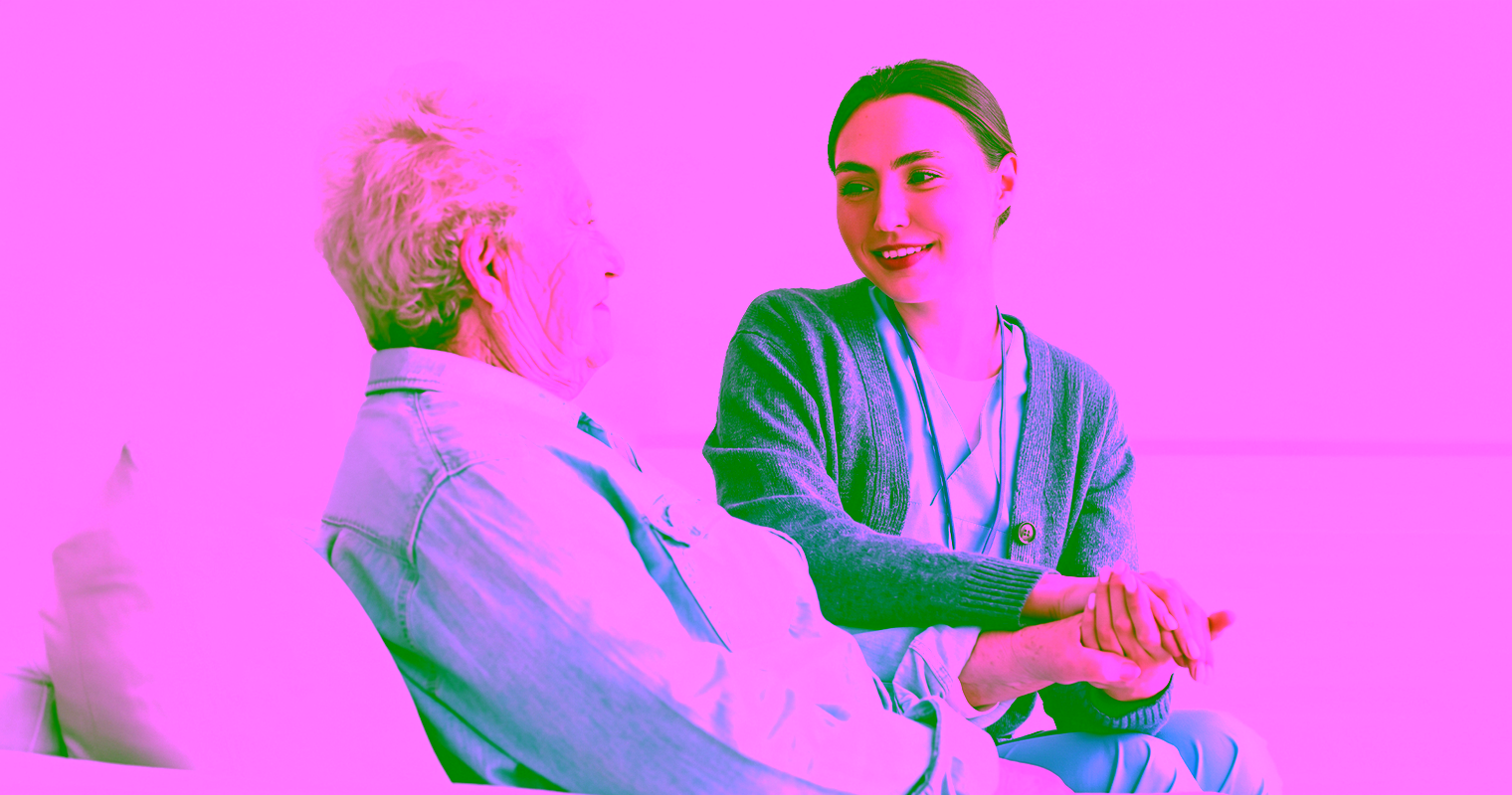 health care worker helping senior woman