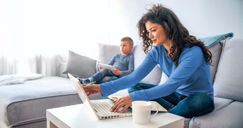 Student mom taking an online class from home.